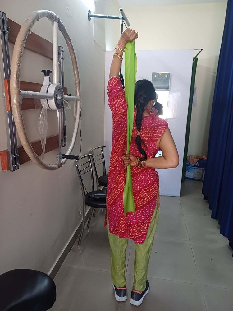 Shoulder mobility resistance band exercise at Hi-Tech Physiotherapy Dehradun